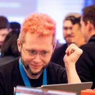 Photo of Matt looking at a computer screen, in full color